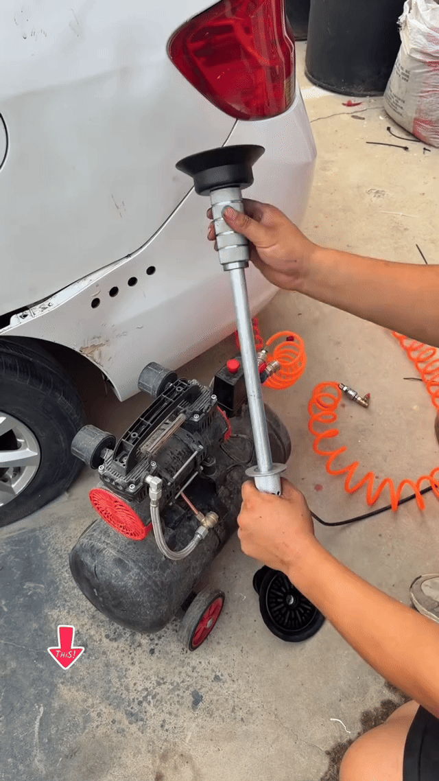 Clenvox Dent Puller connected to a garage air compressor